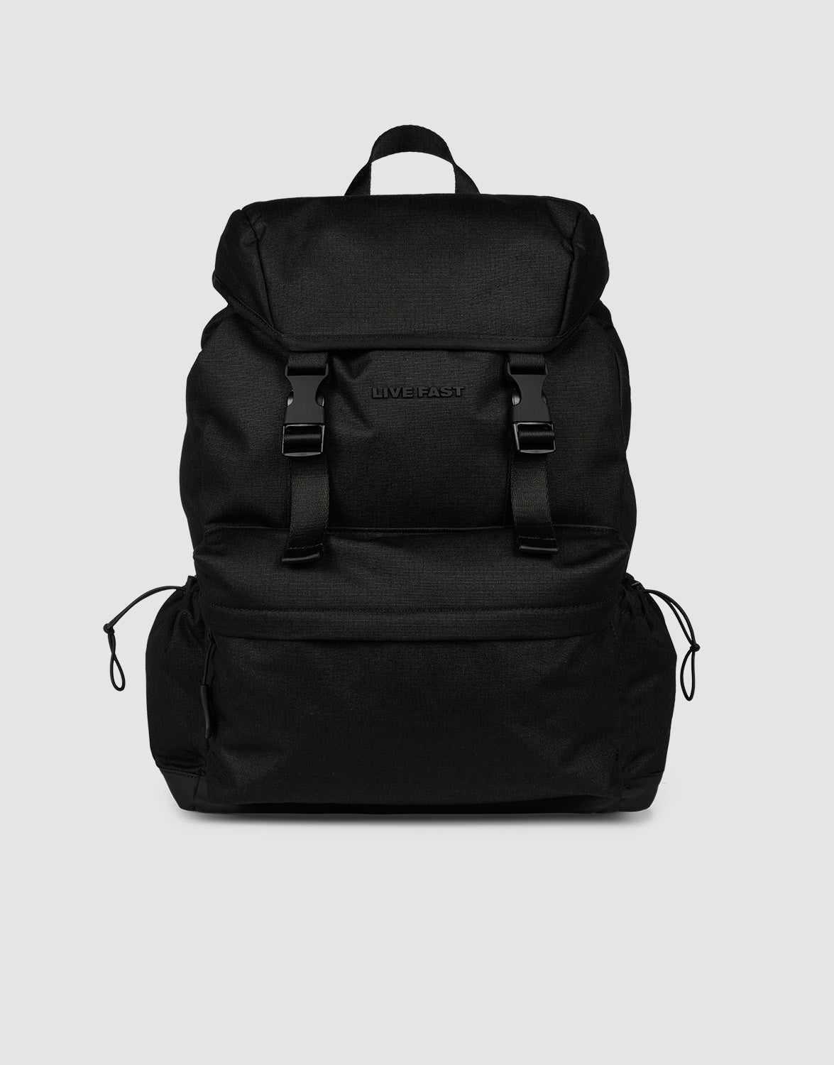 The LFDY Travel Backpack by LIVE FAST DIE YOUNG is a black 25L rucksack featuring adjustable shoulder straps, a top flap, two front buckles, side drawstring pockets, and a top handle, shown against a plain light gray background.| plain 