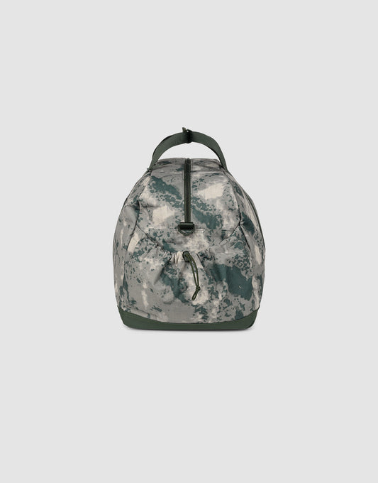 The LIVE FAST DIE YOUNG LFDY Weekender 60, a duffle bag with green and gray camo, stands upright on a white background. It features a top handle, shoulder strap, and central zipper—ideal as a 60-liter sport bag.
