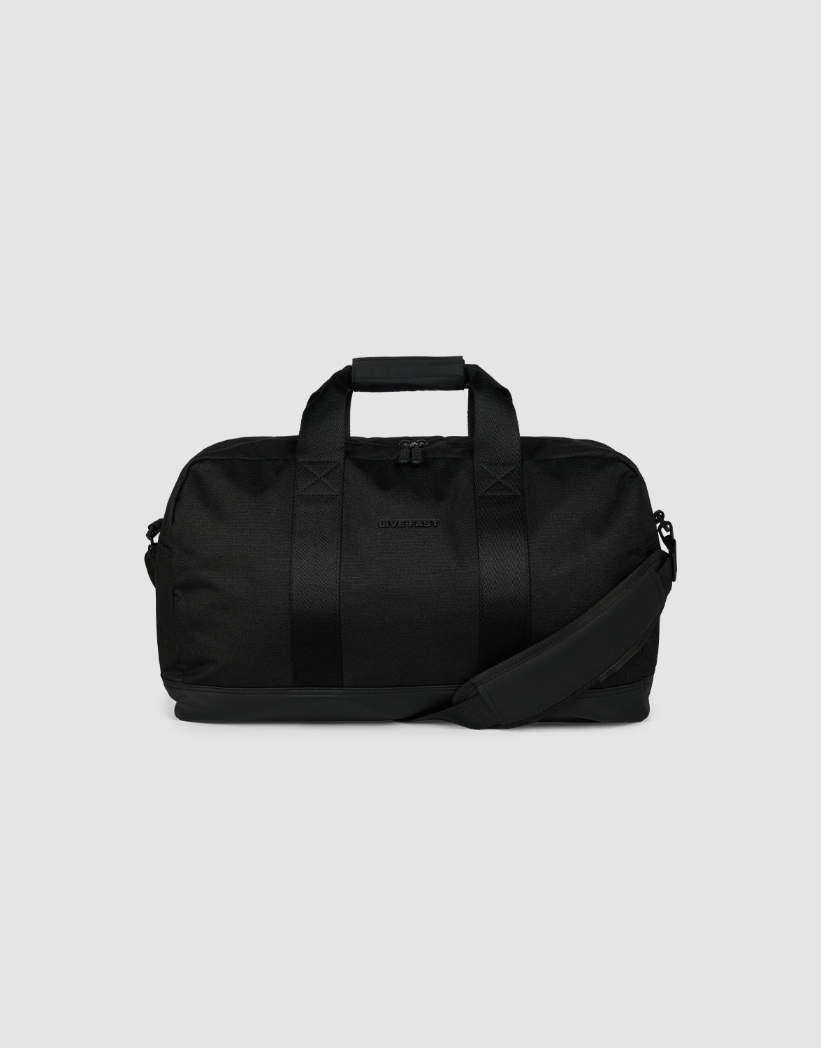 The LFDY Weekender 50 by LIVE FAST DIE YOUNG is a black 30L bag with two handles, a detachable shoulder strap, and a zippered main compartment, shown against a plain light gray background.| plain 