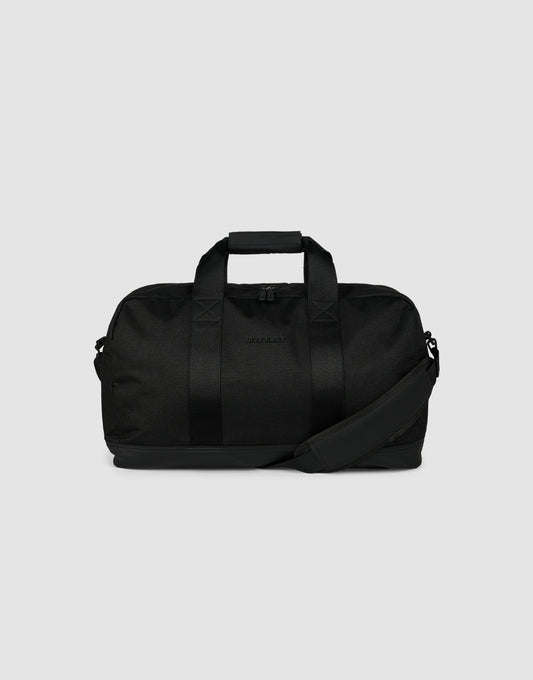 The LFDY Weekender 50 by LIVE FAST DIE YOUNG is a black 30L bag with two handles, a detachable shoulder strap, and a zippered main compartment, shown against a plain light gray background.| plain 