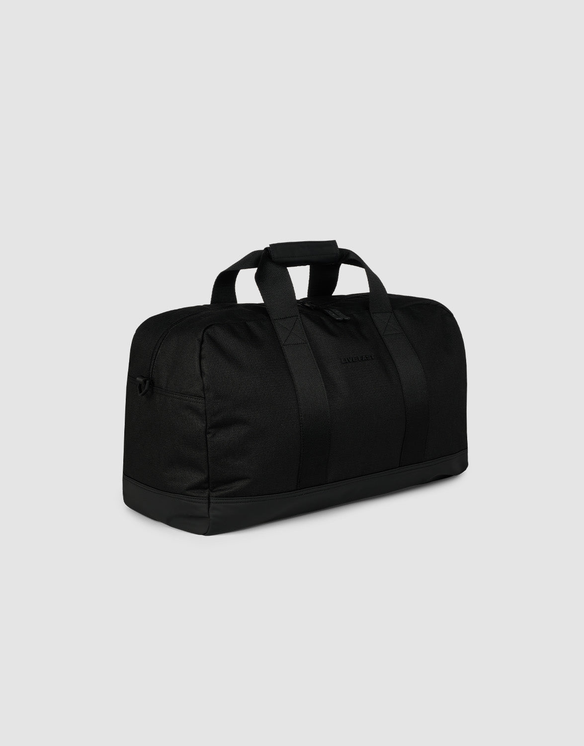 The LFDY Weekender 50 by LIVE FAST DIE YOUNG is a black duffel bag made of durable polyester, featuring reinforced straps, a zippered top, sturdy handles, and a detachable shoulder strap, shown on a plain light gray background.