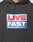 The Live Fast Box Hooded by LIVE FAST DIE YOUNG is a black, oversized hoodie with a bold puffer print: LIVE in red on a white and blue background above FAST in white on blue; INTERNATIONAL DESIGN CORP. LFDY below and a flag-label accent.