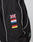 The LFDY Canvas Jacket by LIVE FAST DIE YOUNG is a black racing jacket with white piping, multicolor logo embroidery of the UK, France, Estonia, and Germany on the sleeve next to a zip pocket and sleek stand-up collar.
