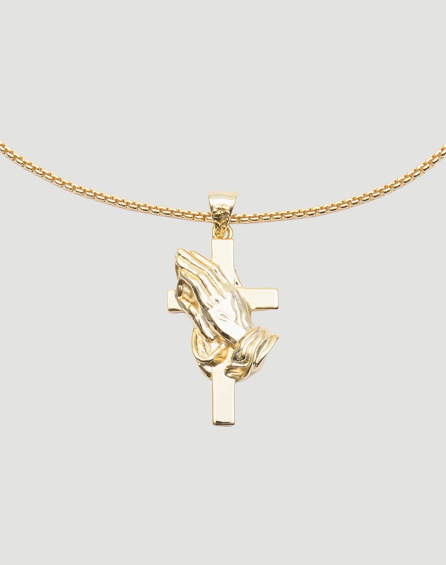 The LFDY Praying Chain by LIVE FAST DIE YOUNG features a vergoldet pendant with praying hands over a cross, displayed on a classic box chain against a plain light gray background.