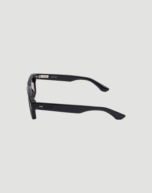 Side view of LIVE FAST DIE YOUNG LFDY x Chimi Shades 03 in black with thick rectangular frames, CR39 lenses, and slightly curved arms, set against a plain light gray background.
