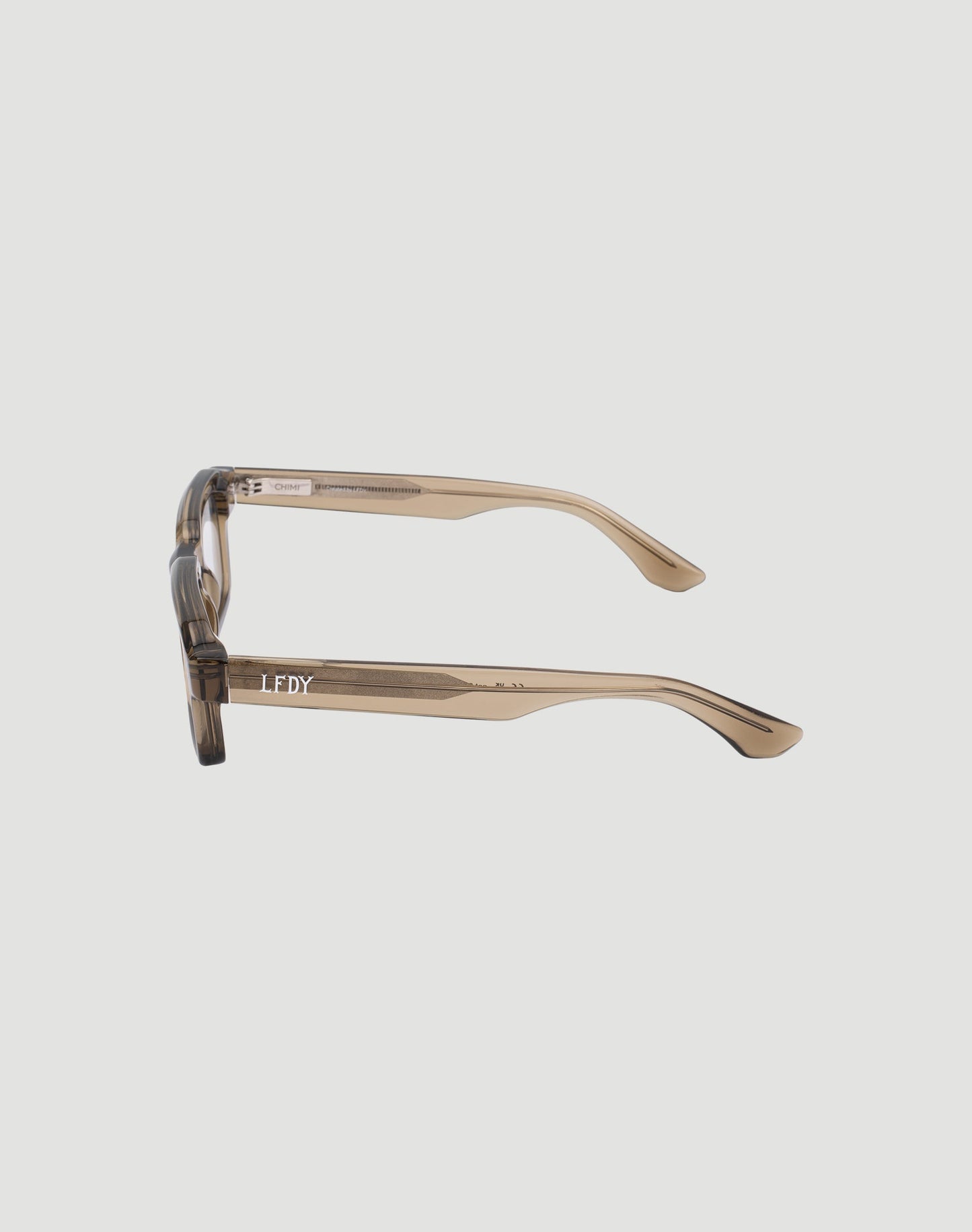 A side view of the LFDY x Chimi Shades 03 shows translucent brown acetate frames, handmade with LIVE FAST DIE YOUNG branding on the temple.