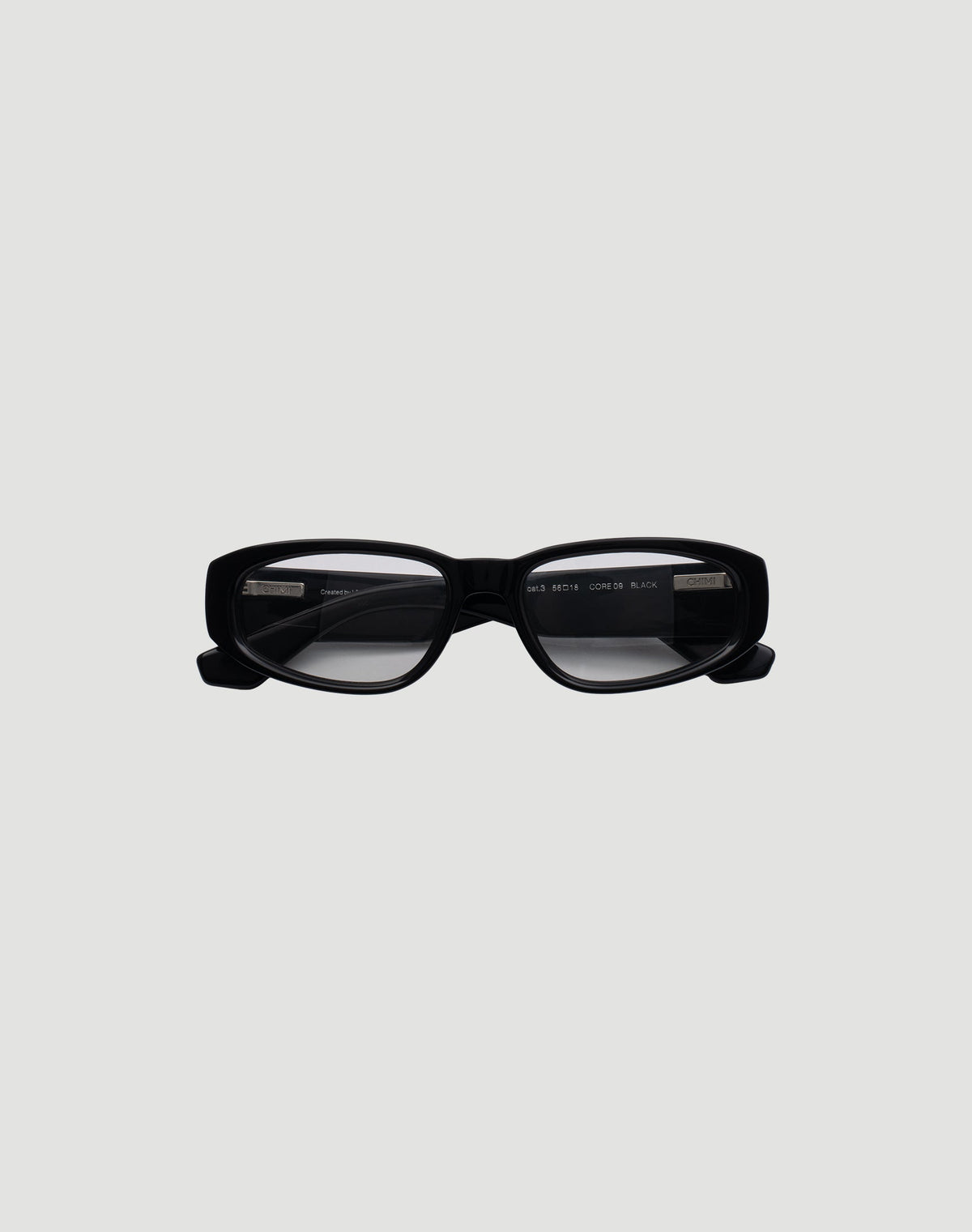 The LFDY x Chimi Shades 09 by LIVE FAST DIE YOUNG feature rectangular black Acetat Brille frames and dark UV-protection lenses, showcased on a plain light gray background. 