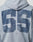 A close-up of the back of the LIVE FAST DIE YOUNG LFDY 55 Hooded Zip in light blue Oversize Fit, with a large distressed navy number 55 and small LFDY below, finished in vintage-washed cotton.