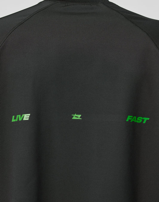 The LFDY Sports Longsleeve by LIVE FAST DIE YOUNG features black fabric with “LIVE” and “FAST” in bold green uppercase letters, separated by a small green symbol, and stylish Raglan sleeves for a modern look.
