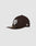 The LFDY X NEW ERA 59FIFTY LOW PROFILE by LIVE FAST DIE YOUNG is a black fitted cap with a flat brim, large white front logo, small white New Era side logo, and a gold visor sticker. Displayed on a plain light gray background.