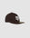 The LFDY X NEW ERA 59FIFTY LOW PROFILE by LIVE FAST DIE YOUNG is a black fitted cap with a flat brim, bold white embroidered front logo, and gold sticker. Its showcased on a plain light gray background.