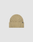 The LIVE FAST DIE YOUNG Rib Knit Beanie is a beige, one size hat with ribbed knit, folded cuff, and a small black Flag-Label tag on the side, made from cozy Polyamid and shown against a plain white background.