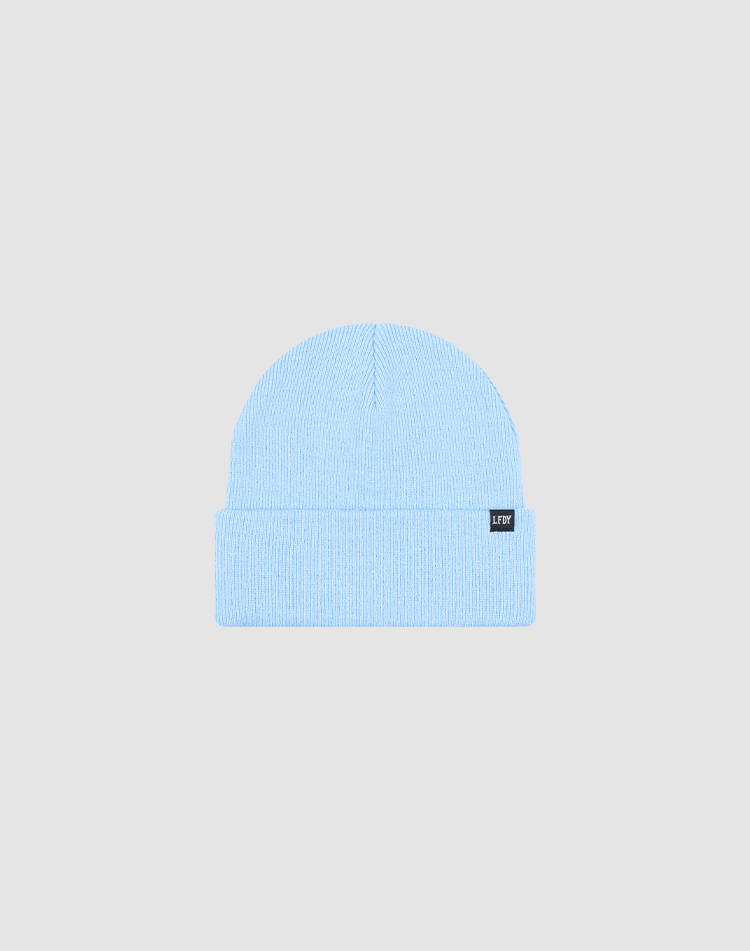 A light blue, ribbed knit Basic Beanie by LIVE FAST DIE YOUNG, One Size, with a folded brim and small black flag-label on the front, shown on a plain light gray background. Made from soft polyamid for cozy comfort.