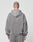 A person with short hair faces away from the camera, wearing a loose-fitting LIVE FAST DIE YOUNG Basic Script Hooded Zip and matching sweatpants in vintage wash against a plain light background.