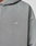 Close-up of the Basic Evidence Hooded by LIVE FAST DIE YOUNG, a gray oversized hoodie featuring white embroidered LFDY™ on the chest. The image showcases its textured fabric, minimal design, and subtle faded look.