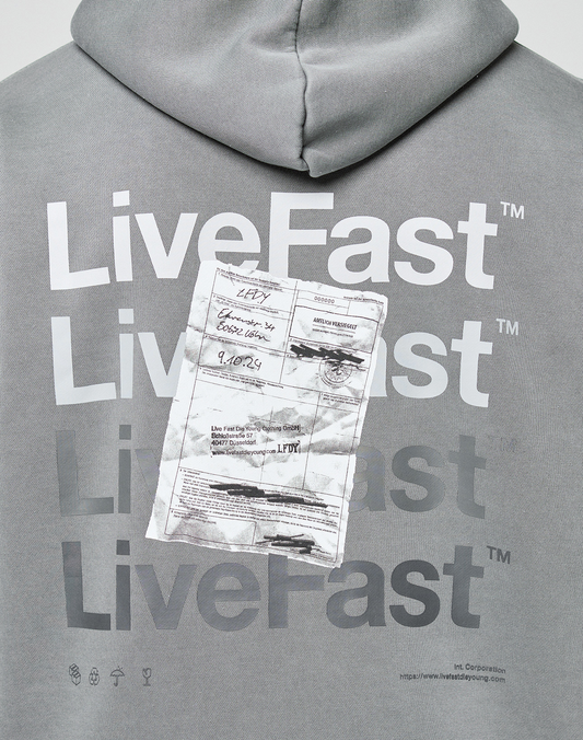 The Basic Evidence Hooded by LIVE FAST DIE YOUNG is a grey hoodie featuring bold white “LiveFast” text and a ripped shipping label on the chest, finished with a subtle faded-look for a worn-in vibe.