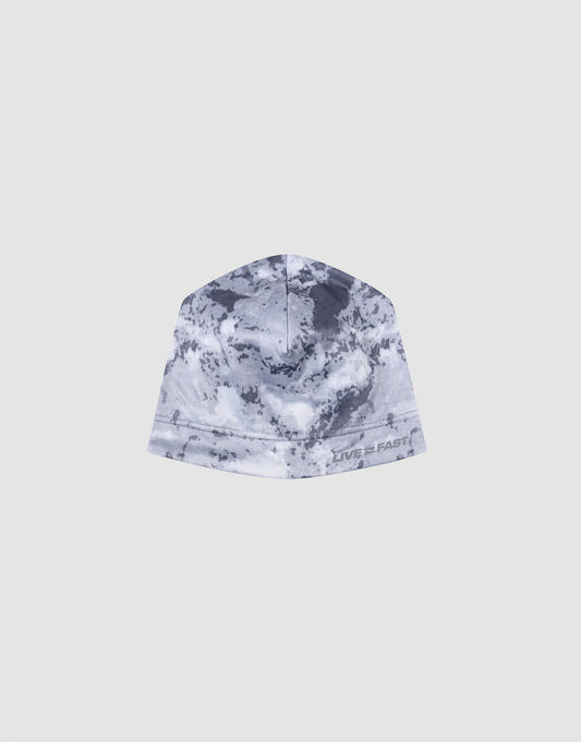 The Live Fast Performance Beanie by LIVE FAST DIE YOUNG features gray and white camo, a soft fleece lining, and “LIVE FAST” printed near the edge, shown against a plain light background.