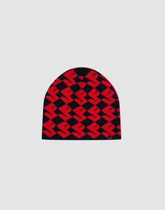 The LF Monogram Beanie by LIVE FAST DIE YOUNG is a red and black polyacryl knit hat with a bold geometric zigzag pattern and Jacquard Monogram, displayed on a plain light gray background. 