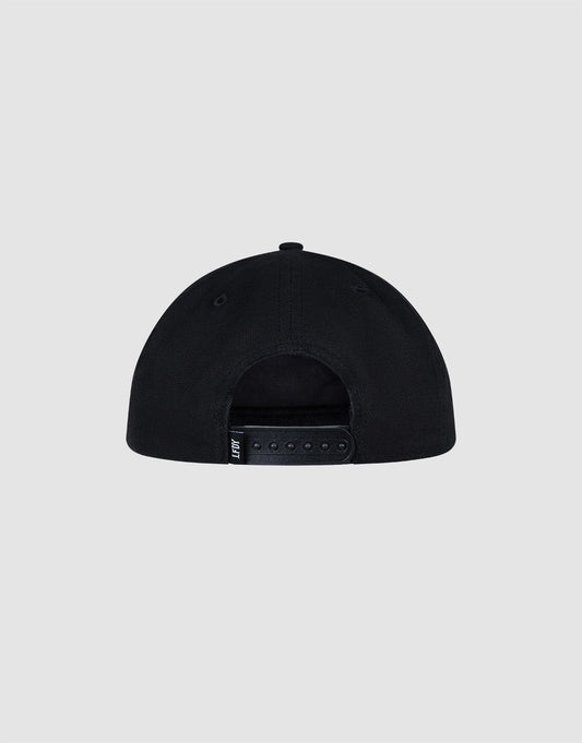 The LFDY Guaranteed Cap by LIVE FAST DIE YOUNG is a black, unstructured 5-panel cap seen from the back, with an adjustable snapback strap and a small black tag on the left. Made of 100% polyester. Set against a plain light gray background.
