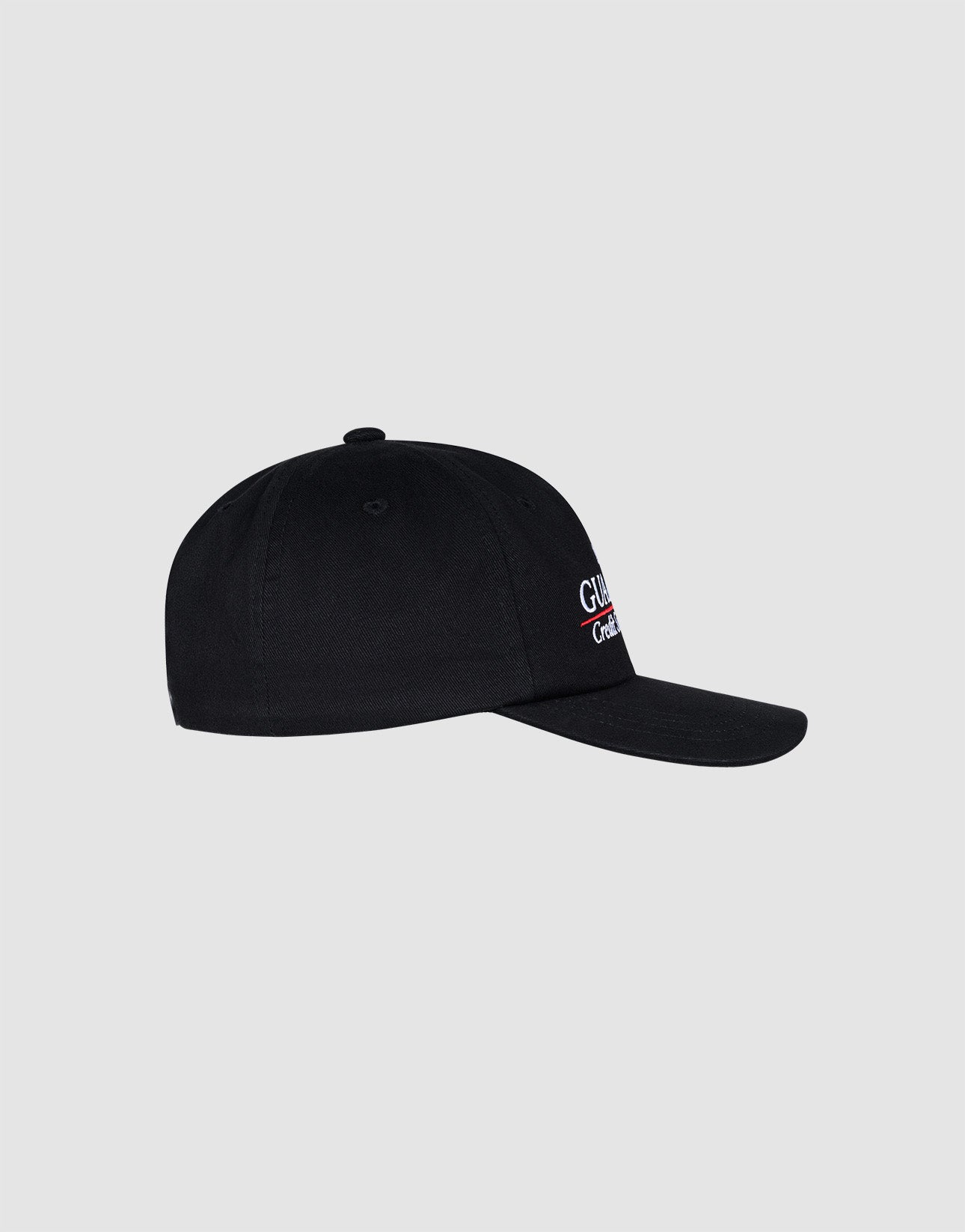 Side view of the black LFDY Guaranteed Cap by LIVE FAST DIE YOUNG, an unstructured 5-panel cap with a curved brim, featuring small white and red text on the front, made from 100% polyester, shown on a plain light gray background.