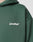 Close-up of the dark green Basic 360 Hooded by LIVE FAST DIE YOUNG, featuring LiveFast™ in white on the chest. Made from a soft cotton-polyester blend; image shows the upper left section without revealing the wearer’s face.