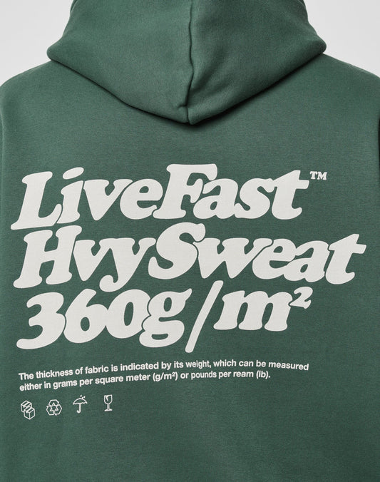 The LIVE FAST DIE YOUNG Basic 360 Hooded: Green oversize fit, bold white back text, stylish front & back print. Made from 70% Baumwolle, heavy LiveFast HvySweat (360g/m²) for premium thickness.