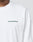 Someone wearing a Basic Longsleeve by LIVE FAST DIE YOUNG, plain white with the brand name printed in small green letters on the upper left chest.
