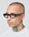 A person with a shaved head, neck and scalp tattoos, wearing a white shirt and LFDY x Chimi Shades 09 by LIVE FAST DIE YOUNG, looks slightly to the side against a plain background.