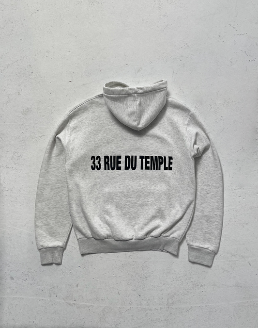 The LFDY Family & France Hooded by LIVE FAST DIE YOUNG is an oversized light gray cotton hoodie, laid flat on a white surface, with front and back prints including bold black "33 RUE DU TEMPLE" text on the back.