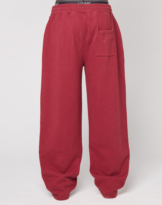 The Live Fast London Wide Jogger by LIVE FAST DIE YOUNG features a wide fit, elastic waistband, black contrast waistband detail, single right patch pocket, and is made from soft Baumwolle. Shown against a white background.