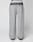 LIVE FAST DIE YOUNG’s Live Fast Boucle Pants feature a wide fit, straight leg, single front pocket, elastic waistband with text, and a gradient from dark to light gray at the waist and ankles. Displayed on a plain background.