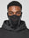A person wears the LIVE FAST DIE YOUNG Live Fast Performance Face Mask—a black mask with white trim, mesh mouth panel, and reflective print—paired with a black hoodie, looking at the camera against a plain background.
