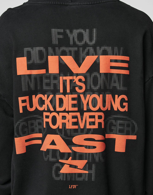 The Print Over Hooded by LIVE FAST DIE YOUNG is a black, oversize-fit sweatshirt made from 100% Baumwolle. It features bold orange “LIVE ITS FUCK DIE YOUNG FOREVER FAST” text over a faint, layered background logo-stick detail.