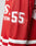 Close-up of the LFDY Hockey Jersey by LIVE FAST DIE YOUNG, showing a red sleeve with bold white 55, white stripes, and partial white logos on polyester fabric.