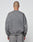A person with a shaved head faces away from the camera, wearing the LIVE FAST DIE YOUNG Basic Chest Sweater in an oversize fit and matching faded gray sweatpants, made of soft cotton, set against a plain light background.