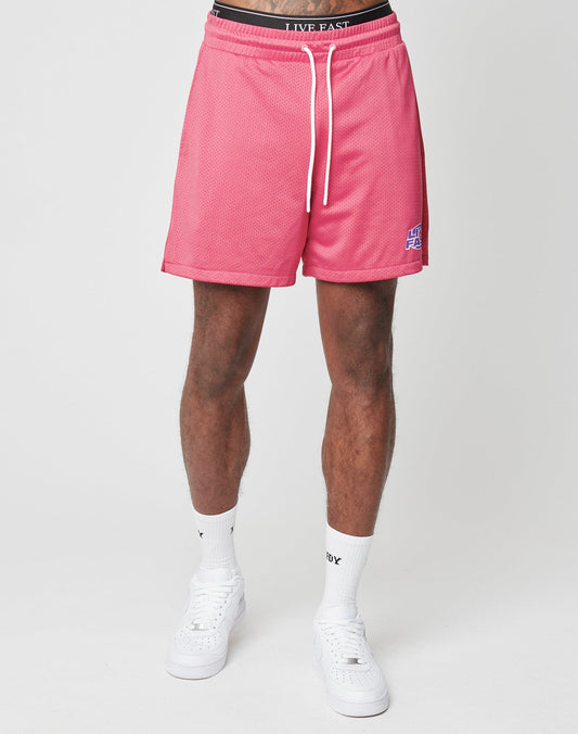 A person models the LFDY Oval Mesh Shorts by LIVE FAST DIE YOUNG, featuring an elastic waistband, paired with white socks and sneakers. Only the lower half of their body is shown against a plain white background.