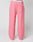 The Live Fast Boucle Pants by LIVE FAST DIE YOUNG are wide fit, pink fleece pants featuring an Elastikbund, side pockets, a straight leg cut, and a small front right patch pocket, shown on a mannequin against a plain background.
