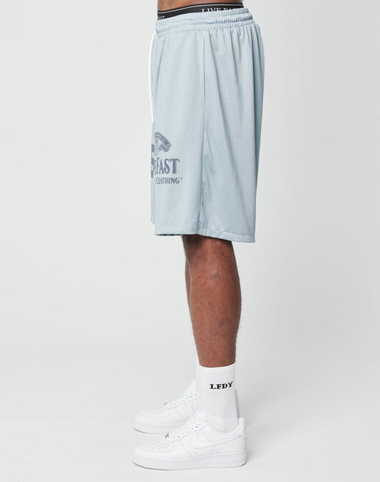 A person’s lower body is shown in LIVE FAST DIE YOUNG LFDY Loyal Shorts (light blue mesh, elastic waist), white crew socks with LFDY text, and white Nike sneakers against a plain white background.