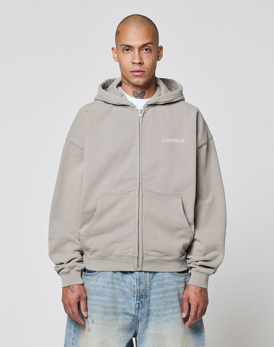 A person with a shaved head wears the LIVE FAST DIE YOUNG Basic 510 Hooded Zip in light gray and faded blue jeans, standing facing forward against a plain white background.