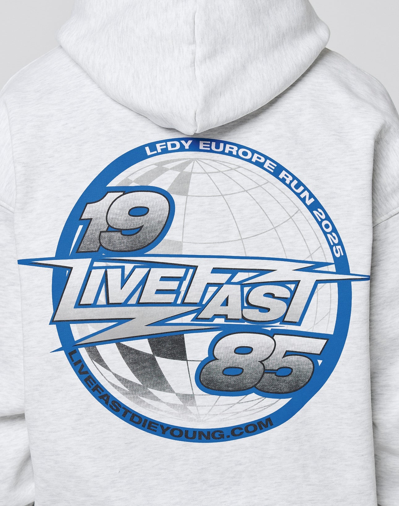 Back of the LFDY Globe Hooded by LIVE FAST DIE YOUNG in light gray cotton-poly blend, features a blue-gray globe graphic and bold text: LIVE FAST 85, LFDY EUROPE RUN 2025, and LIVEFASTDIEYOUNG.COM. Oversize fit.