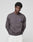 A person wears the oversized LFDY Network Sweater by LIVE FAST DIE YOUNG in dark grey Baumwolle, featuring purple "LIVE FAST DEATH LAST" prints on front and back, standing against a plain light background and facing the camera.