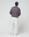 A person stands facing away in a dark cap, white loose pants, and the LIVE FAST DIE YOUNG "LFDY Network Sweater," an oversized purple cotton sweatshirt with LIVEFAST front and back print, against a plain light studio background.