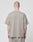 A person with a shaved head stands with their back to the camera, wearing the LIVE FAST DIE YOUNG Basic Script Tee in taupe—loose-fitting, short-sleeve cotton with vintage wash—and matching pants, set against a plain light gray background.