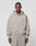A man faces forward in a LIVE FAST DIE YOUNG Basic 510 Hooded Zip, light gray with front pockets and matching sweatpants, against a plain light background.