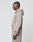 A person with braided hair stands in profile, facing left, wearing the taupe-colored Basic 510 Hooded Zip by LIVE FAST DIE YOUNG against a plain white background.