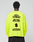 A person wears the LFDY Real Est.8 Longsleeve by LIVE FAST DIE YOUNG, an oversized neon yellow 100% cotton shirt with bold black “LFDY REAL EST. 8” front and back prints, “GET YOUR OFFER NOW!”, dealership text, and a stylized graphic.