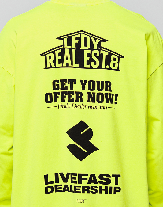 Back of the bright yellow LFDY Real Est.8 Longsleeve by LIVE FAST DIE YOUNG in Oversize Fit, with bold black text, stylized logo, and LIVEFAST DEALERSHIP print. Made from 100% Baumwolle, features striking Front- und Backprint.