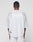 A person faces away from the camera, wearing the LIVE FAST DIE YOUNG Basic Mesh Jersey in white with red piping, a small geometric patch near the hem, V-neckline, and paired with matching white shorts.