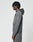 A person with medium-length braided hair stands in profile, wearing the LIVE FAST DIE YOUNG LFDY Active Fleece Hooded Zip and matching gray oversized pants, both featuring subtle logo prints, set against a plain white background.
