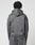 A person with short, twisted hair is seen from the back wearing the LIVE FAST DIE YOUNG LFDY Active Fleece Hooded Zip—a gray, oversized sweatshirt in 100% Baumwolle, with curved seams and a small white Live Fast logo on the upper back.